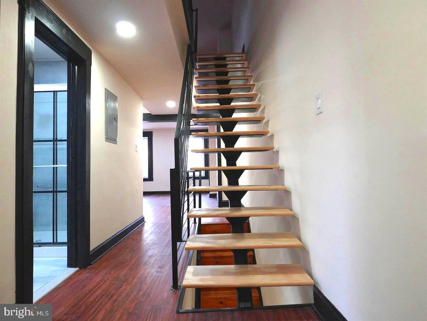 5013 Chester Avenue, Unit 1 Philadelphia, PA 19143 - Photo 5 of 12 a view of entryway and hall with wooden floor