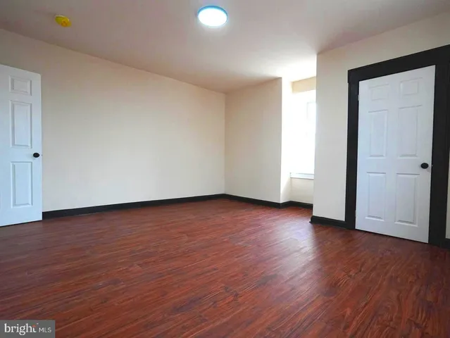 a view of a livingroom with wooden floor