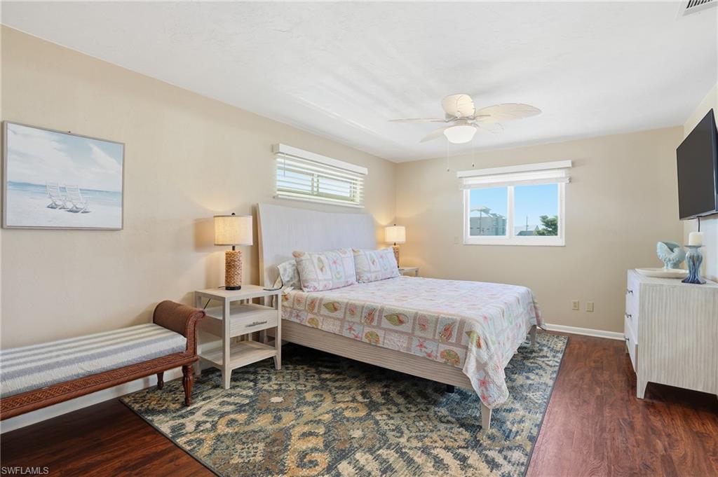 170 Redfish Road Fort Myers Beach, FL 33931 - Photo 20 of 48 a bedroom with a bed and a desk in it