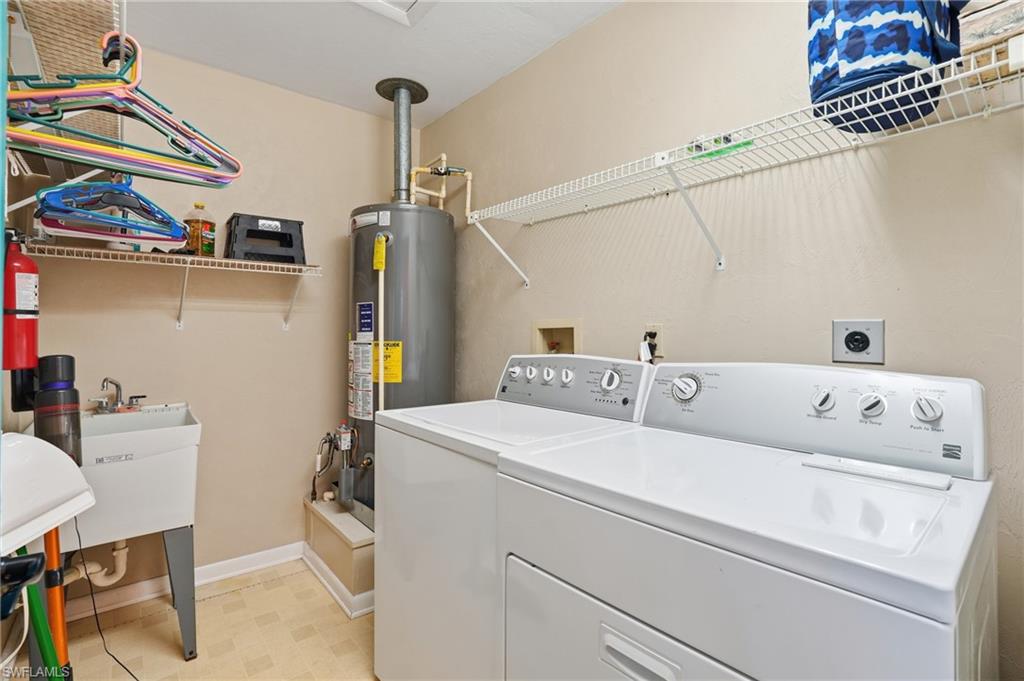 170 Redfish Road Fort Myers Beach, FL 33931 - Photo 24 of 48 a utility room with dryer and washer