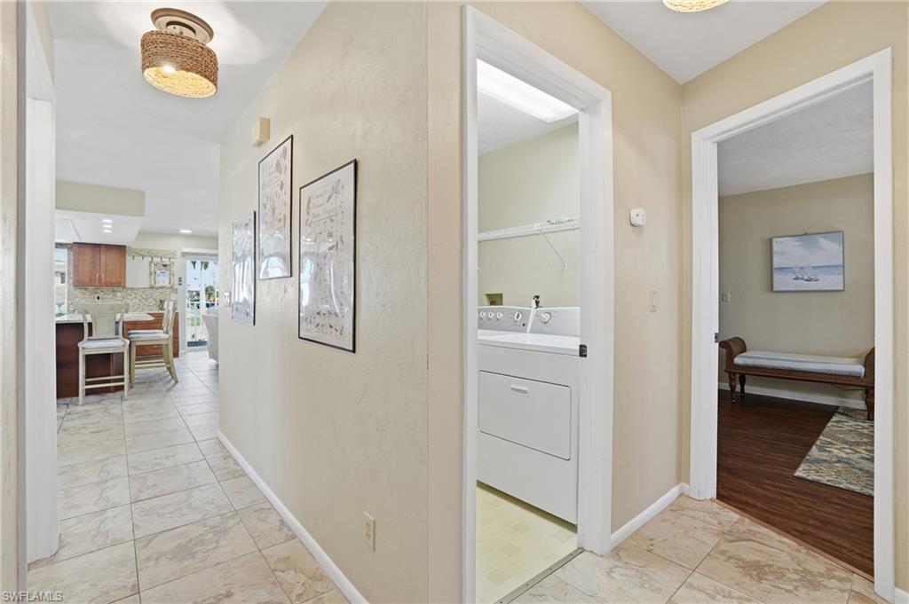 170 Redfish Road Fort Myers Beach, FL 33931 - Photo 25 of 48 a bathroom with a shower and a sink