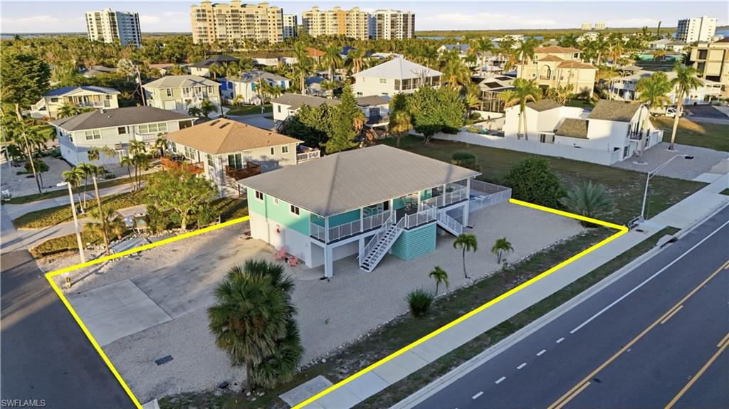 170 Redfish Road Fort Myers Beach, FL 33931 - Photo 38 of 48 an aerial view of residential houses with outdoor space