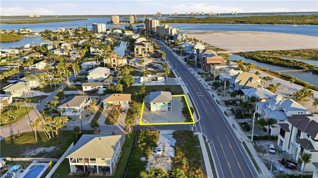 170 Redfish Road Fort Myers Beach, FL 33931 - Photo 47 of 48 an aerial view of a residential building and lake view