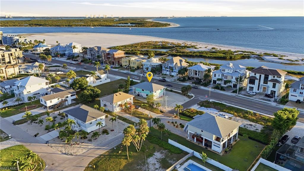 170 Redfish Road Fort Myers Beach, FL 33931 - Photo 5 of 48 a view of a city with lawn chairs