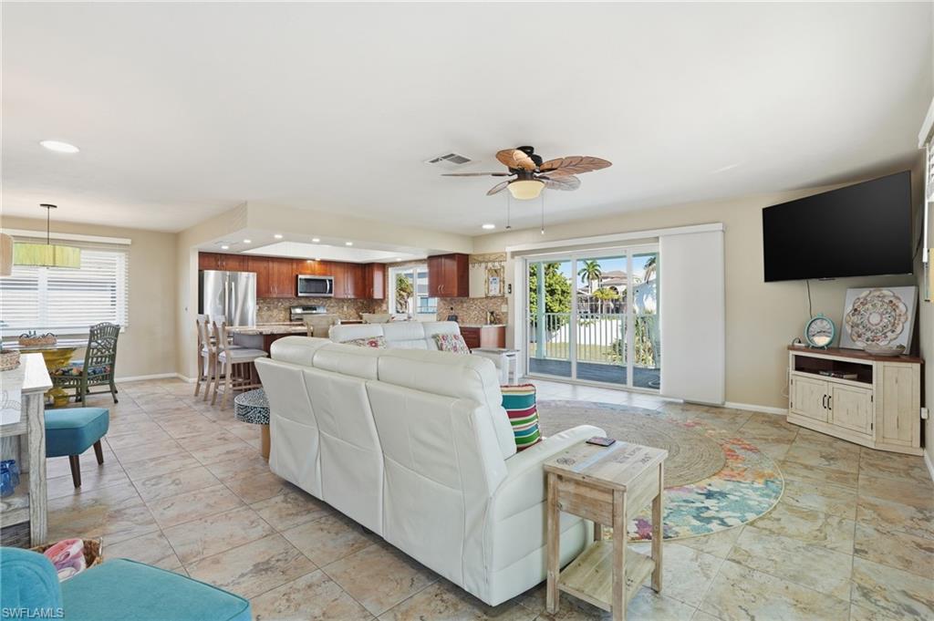 170 Redfish Road Fort Myers Beach, FL 33931 - Photo 8 of 48 a living room with furniture and a flat screen tv