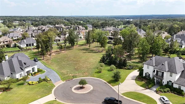 an aerial view of a house with outdoor space