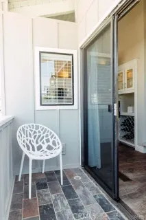 a view of a room that has a table and chair in it