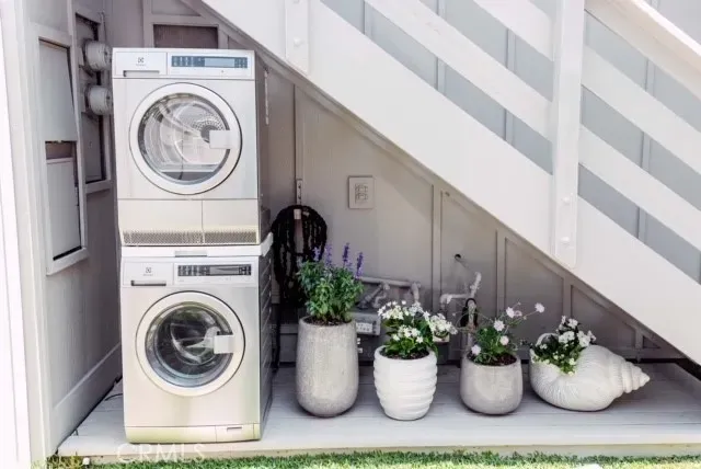 a view of a living room with furniture and flowers