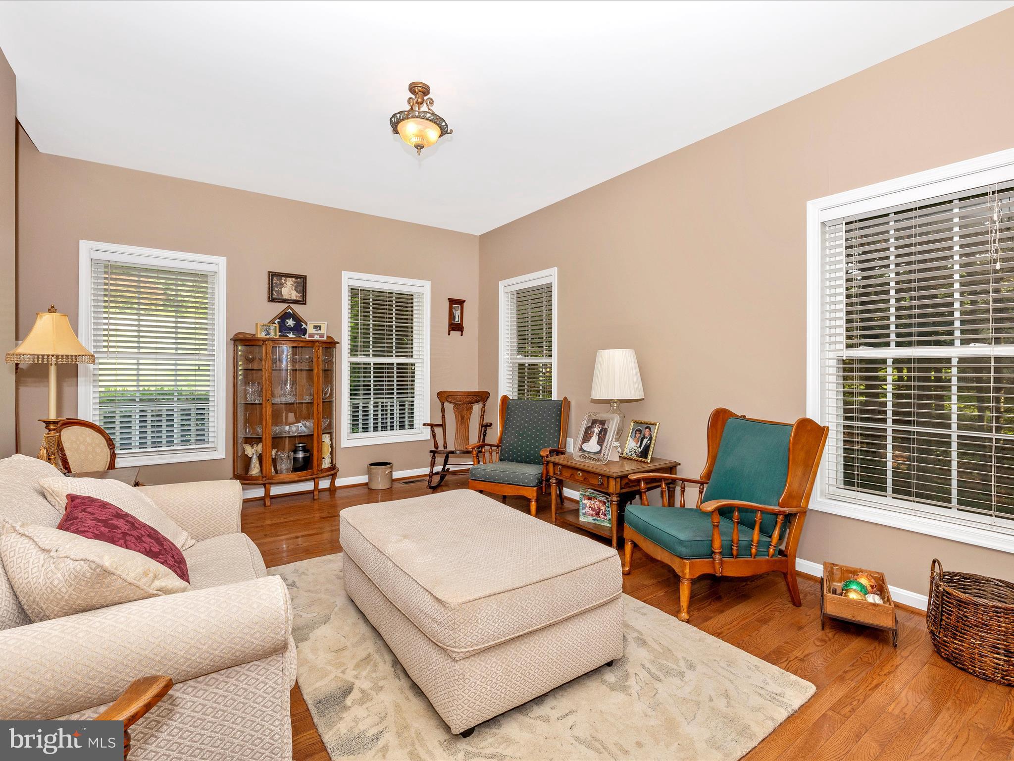 9503 Childacrest Drive Boonsboro, MD 21713 - Photo 11 of 59 a living room with furniture fireplace and a table