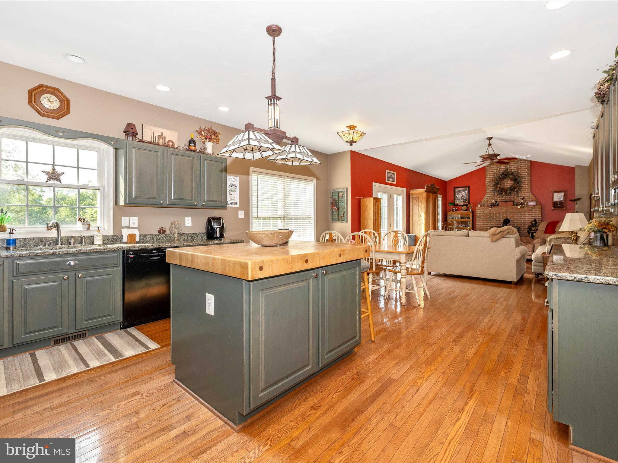 9503 Childacrest Drive Boonsboro, MD 21713 - Photo 17 of 59 a kitchen with stainless steel appliances granite countertop a stove a sink dishwasher and a refrigerator with wooden floor