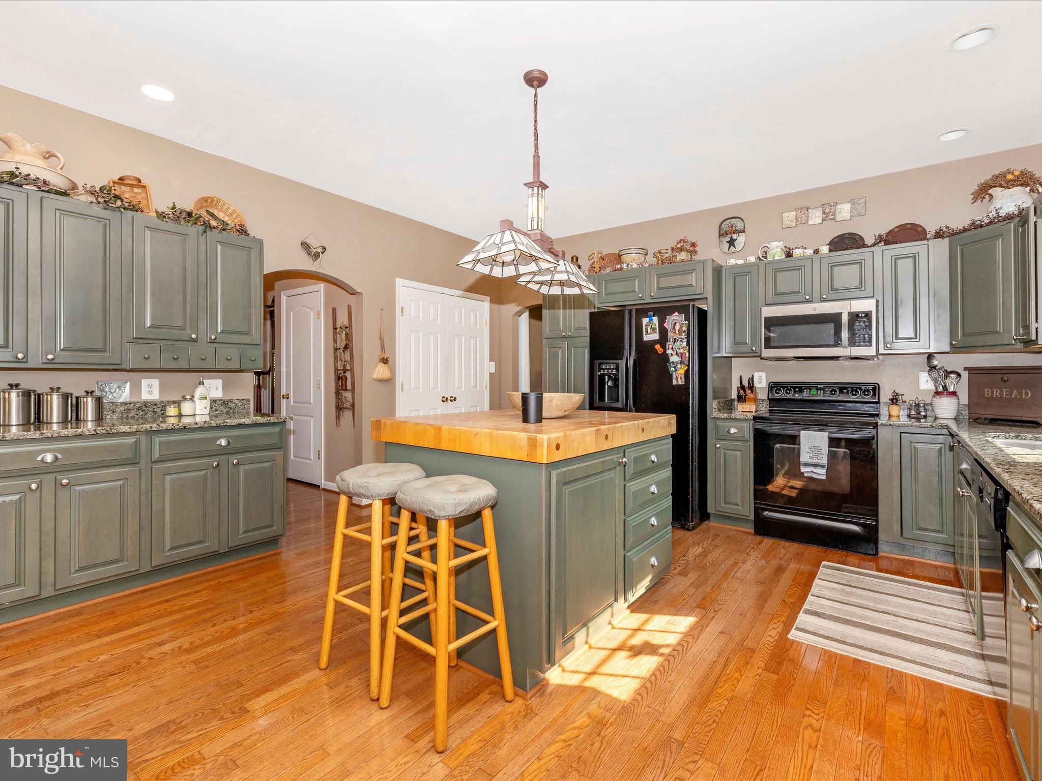 9503 Childacrest Drive Boonsboro, MD 21713 - Photo 19 of 59 a large kitchen with stainless steel appliances granite countertop a stove and a refrigerator