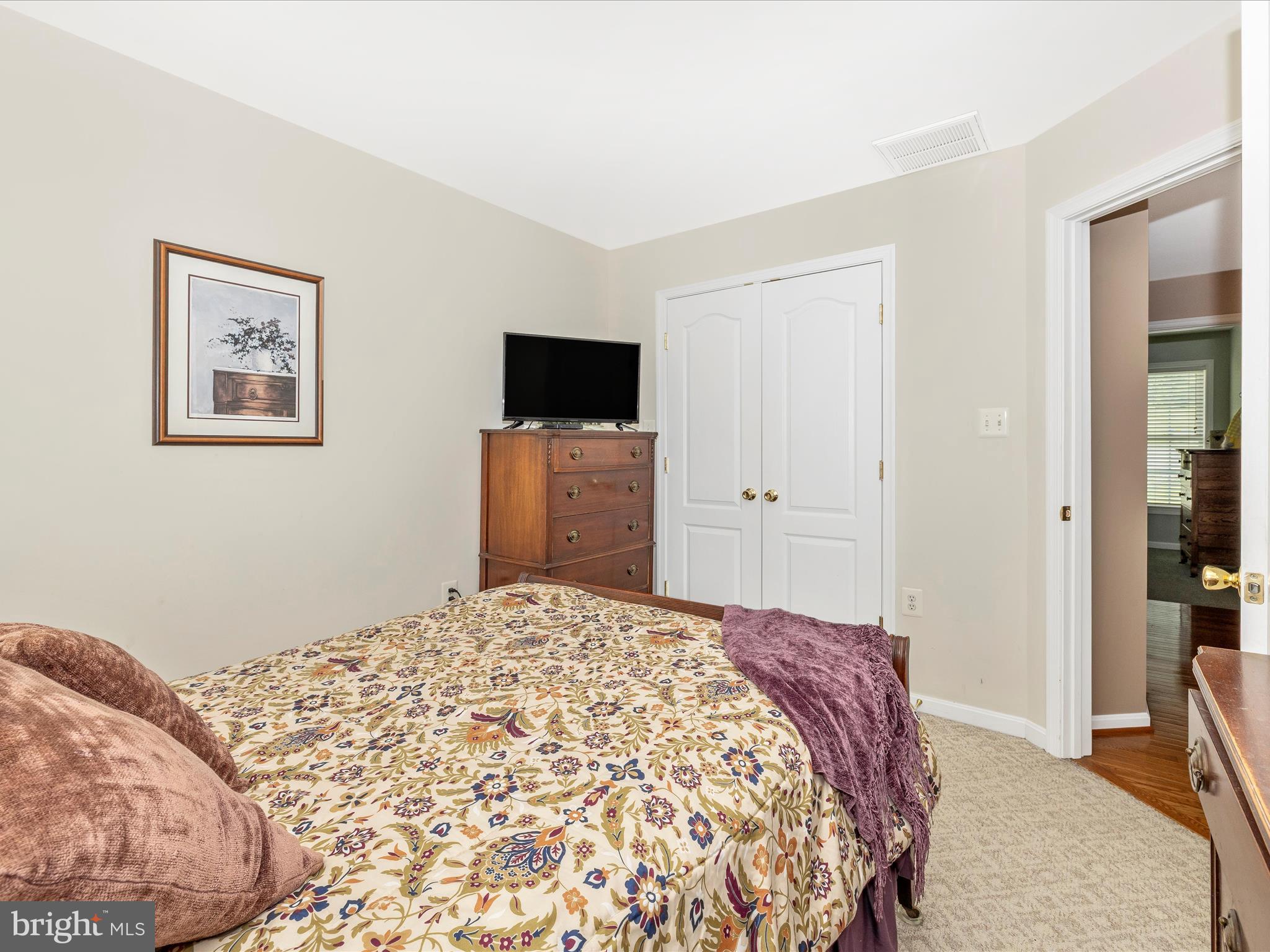 9503 Childacrest Drive Boonsboro, MD 21713 - Photo 37 of 59 a bedroom with a bed and a flat screen tv