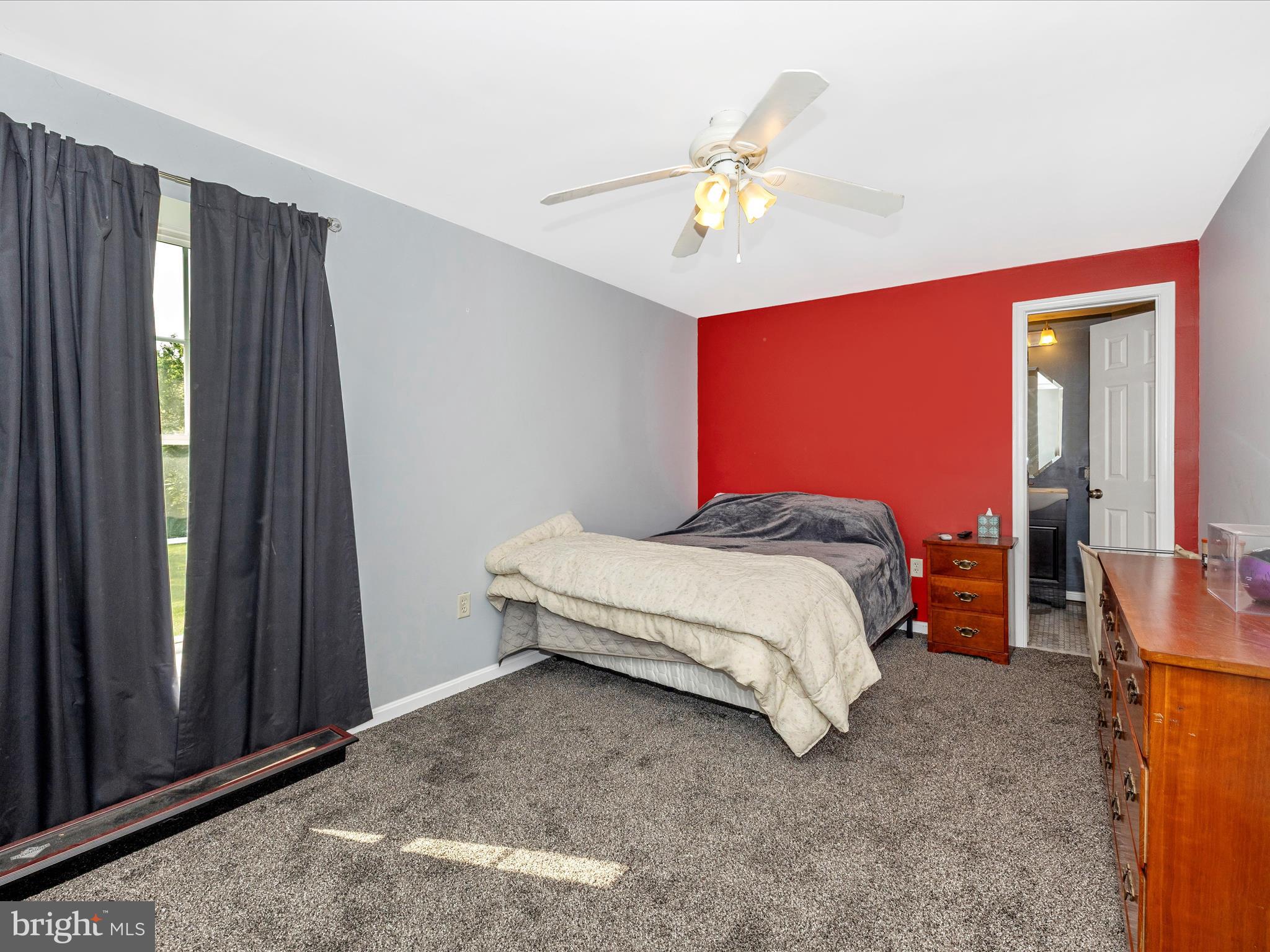 9503 Childacrest Drive Boonsboro, MD 21713 - Photo 41 of 59 a bedroom with a bed and a chandelier