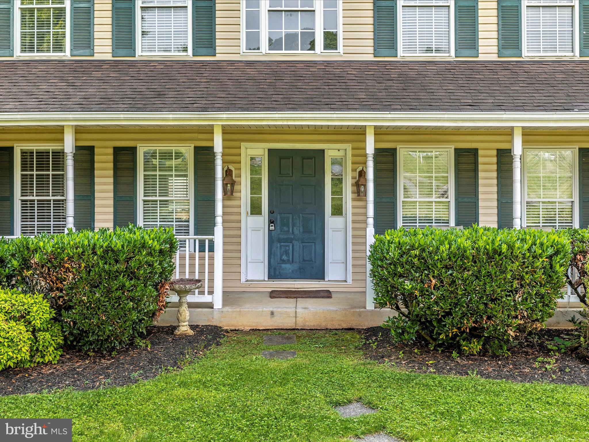 9503 Childacrest Drive Boonsboro, MD 21713 - Photo 5 of 59 a front view of a house with a yard