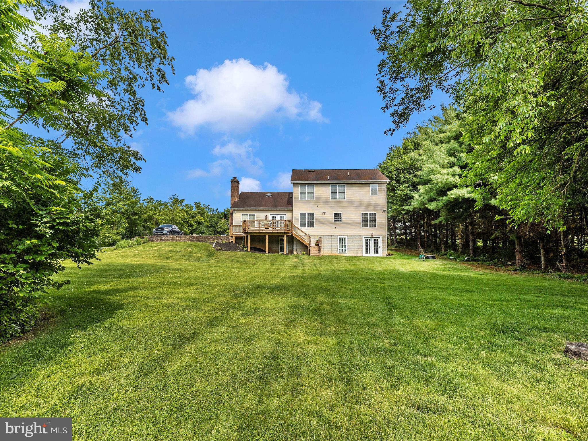 9503 Childacrest Drive Boonsboro, MD 21713 - Photo 55 of 59 a backyard of a house with table and chairs