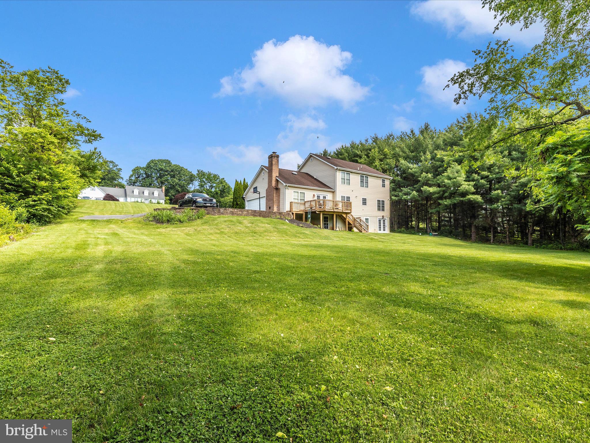 9503 Childacrest Drive Boonsboro, MD 21713 - Photo 57 of 59 a view of a big yard with palm trees and a yard