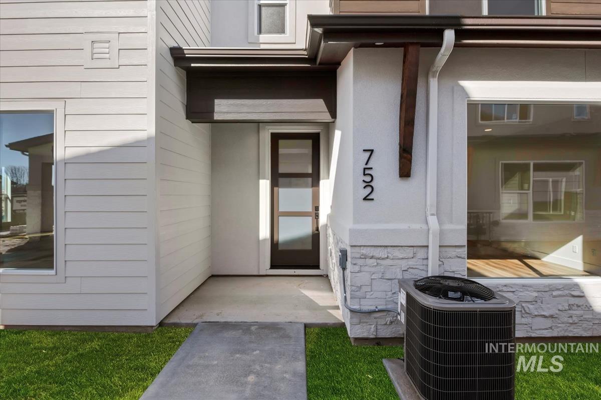 752 South Calhoun Lane Star, ID 83669 - Photo 2 of 45 Contemporary exterior featuring a panelized white facade and dark trim