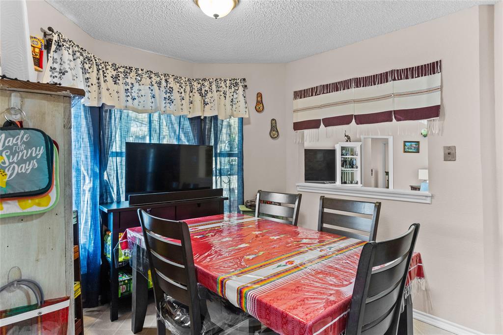 2626 Collard Road Arlington, TX 76017 - Photo 28 of 40 a living room with furniture and a flat screen tv