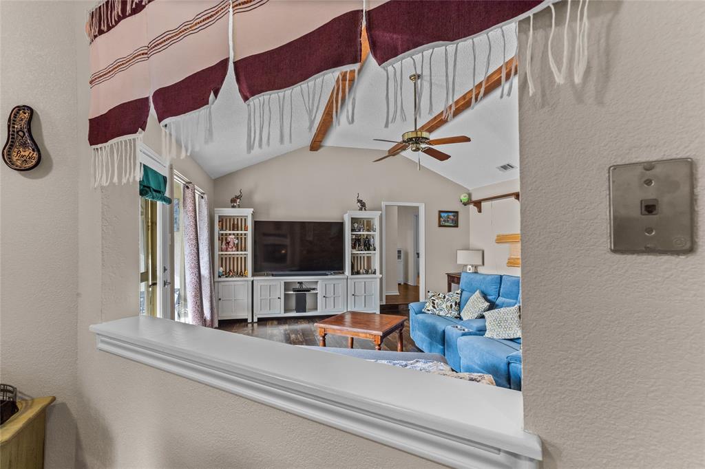 2626 Collard Road Arlington, TX 76017 - Photo 32 of 40 a living room with furniture and a flat screen tv