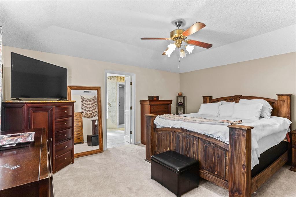 2626 Collard Road Arlington, TX 76017 - Photo 33 of 40 a bedroom with bed and tv