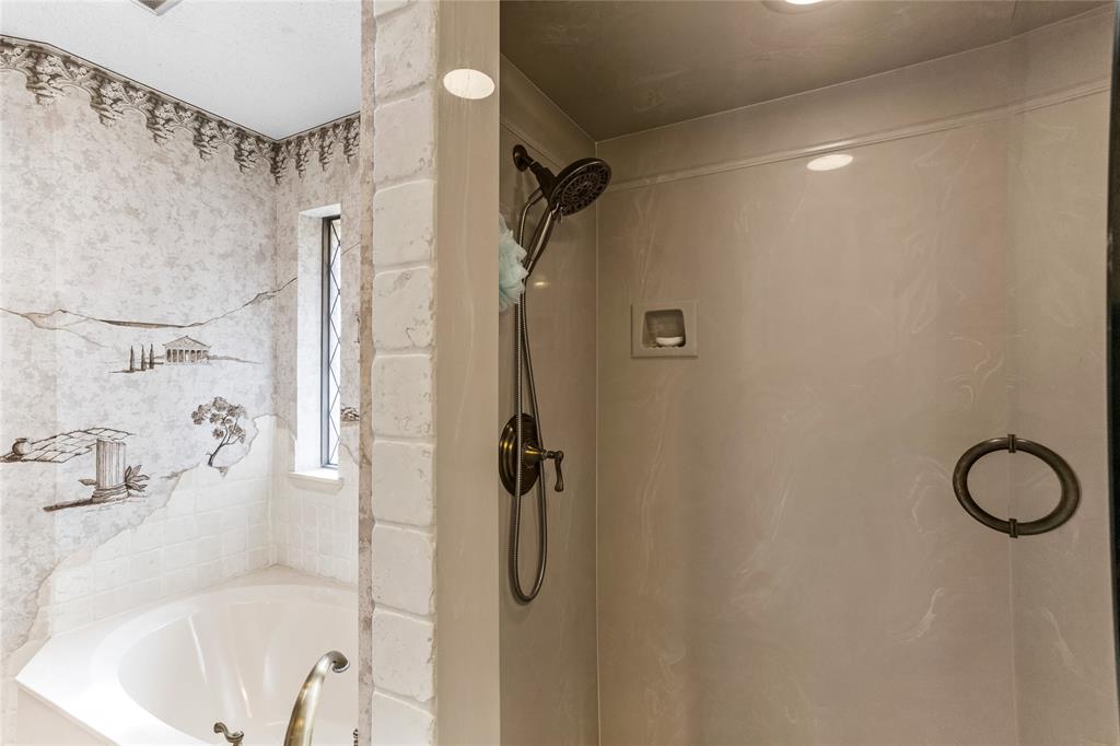 2626 Collard Road Arlington, TX 76017 - Photo 39 of 40 a bathroom with a bath tub with a shower
