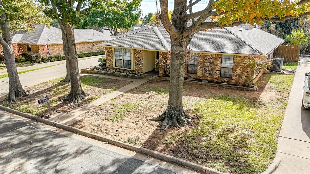 2626 Collard Road Arlington, TX 76017 - Photo 4 of 40 a front view of a house with garden