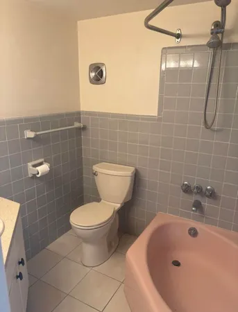 a bathroom with a toilet and a sink