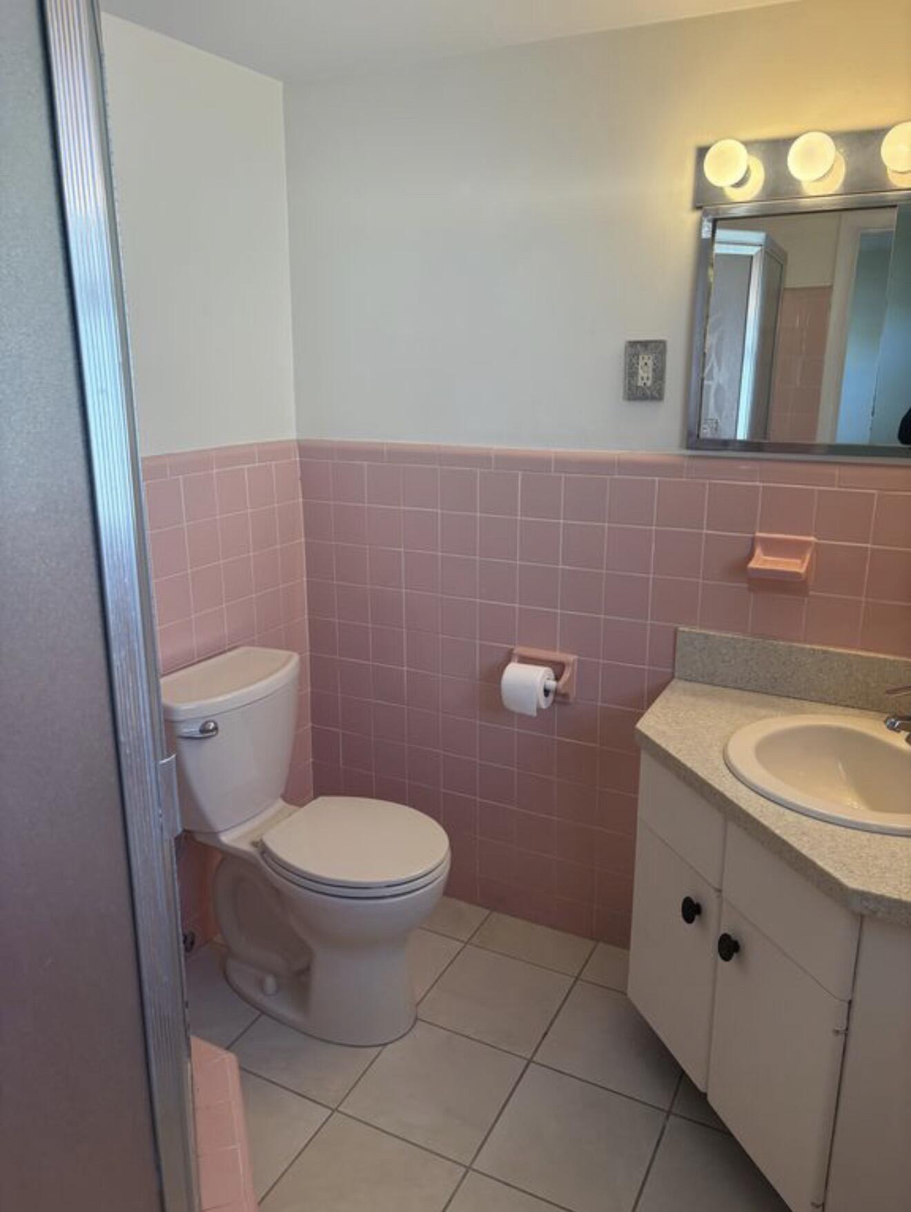 220 Inlet Way, Unit 3 Palm Beach Shores, FL 33404 - Photo 16 of 16 a bathroom with a sink a toilet and mirror