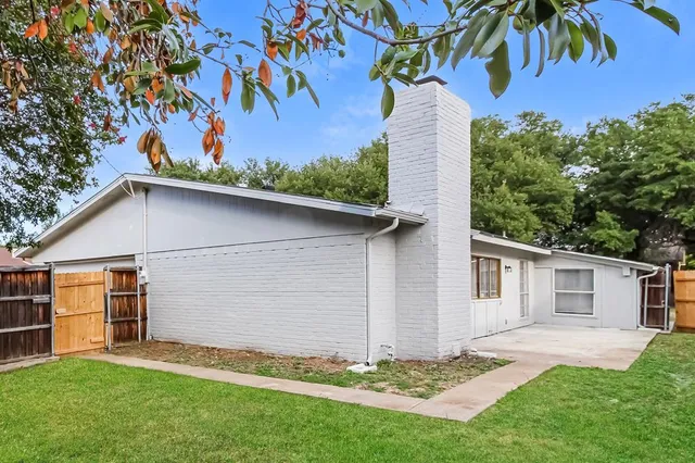 a backyard of a house with lots of green space