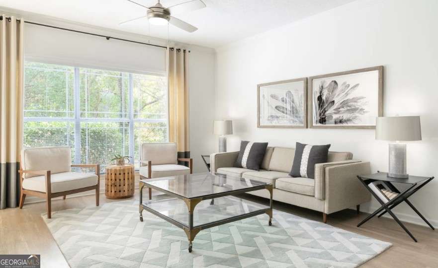 2500 Shallowford Road, Unit 4403 Atlanta, GA 30345 - Photo 5 of 20 a living room with furniture and a large window