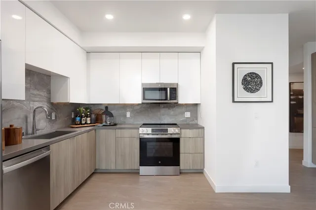 a kitchen with a stove and a microwave