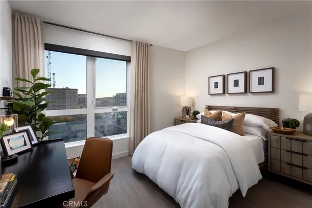 a bed room with a bed window and a chair