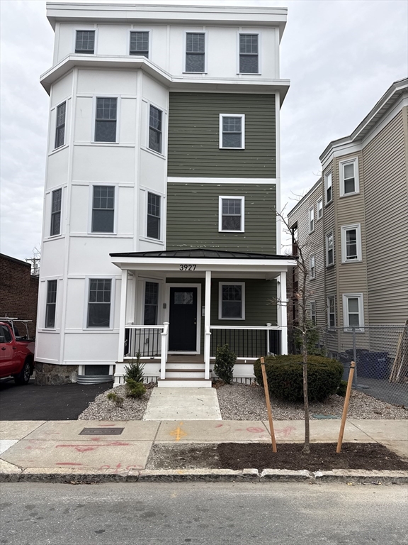 a front view of a house with garage