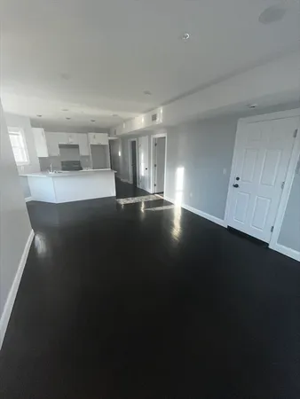a kitchen with a sink a refrigerator and window