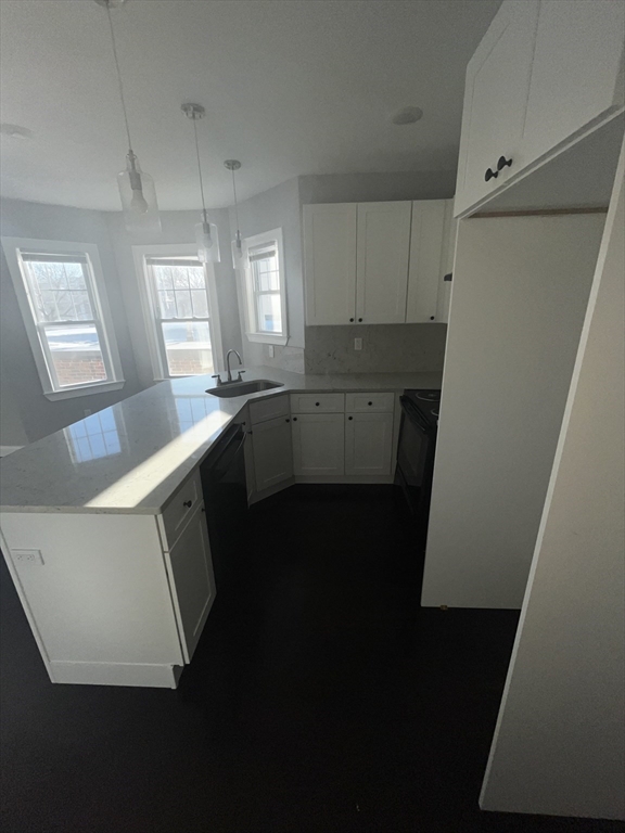 3927 Washington Street, Unit 2 Boston, MA 02131 - Photo 8 of 9 a kitchen with a sink a refrigerator and window