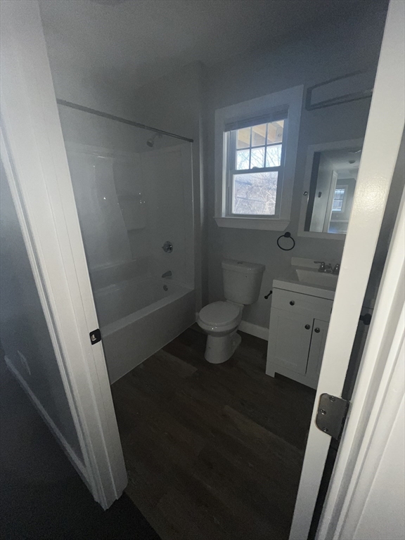 3927 Washington Street, Unit 2 Boston, MA 02131 - Photo 9 of 9 a bathroom with a granite countertop sink toilet and shower