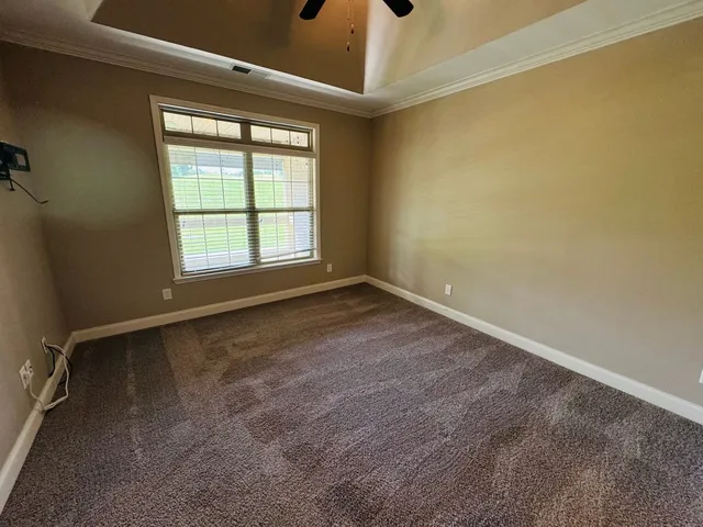 an empty room with a empty space and a window