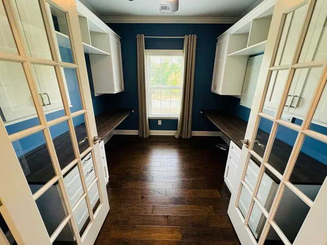 a view of an entryway with wooden floor and stairs