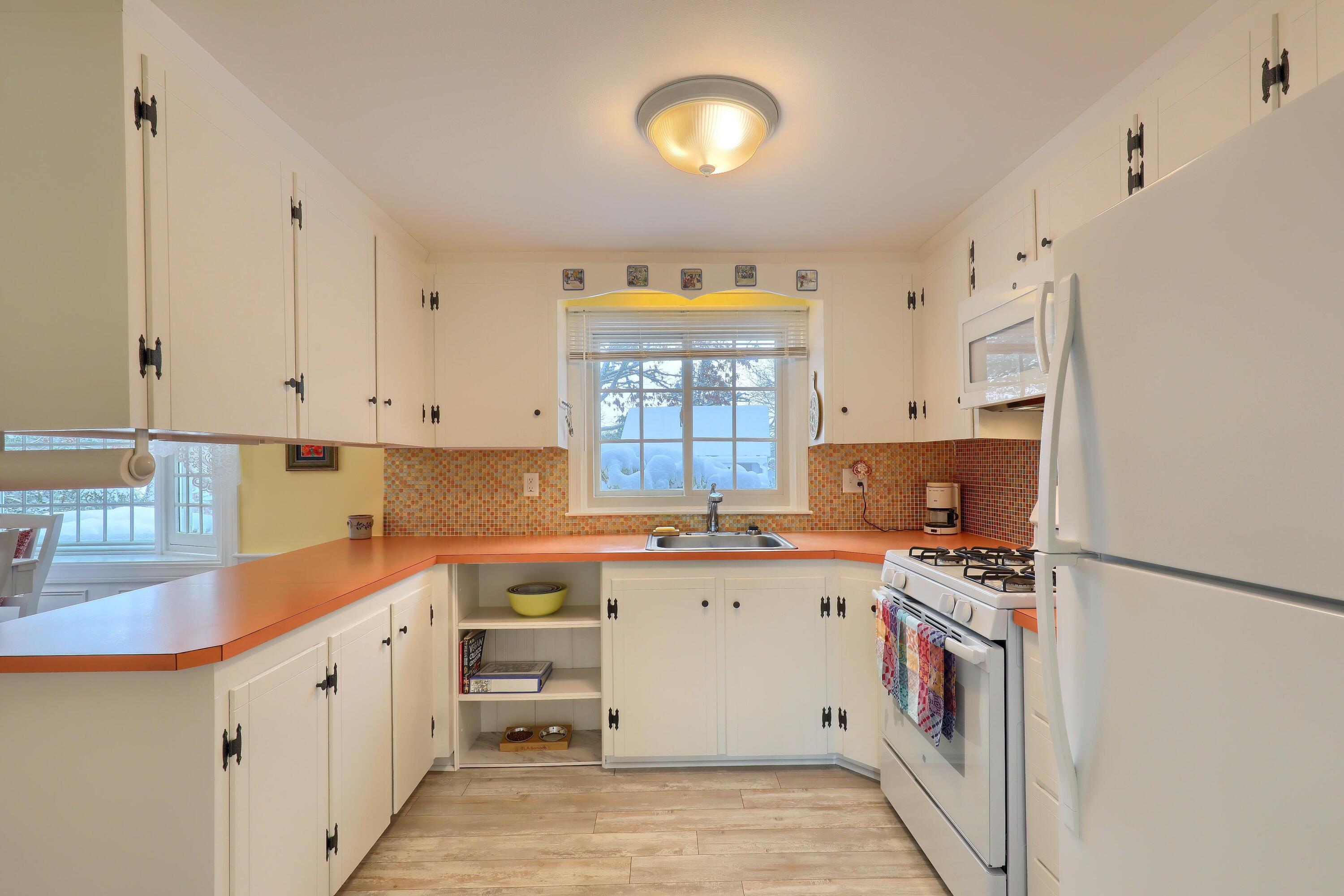 9 Captain Chase Road South Yarmouth, MA 02664 - Photo 11 of 28 a kitchen that has a sink and a stove in it