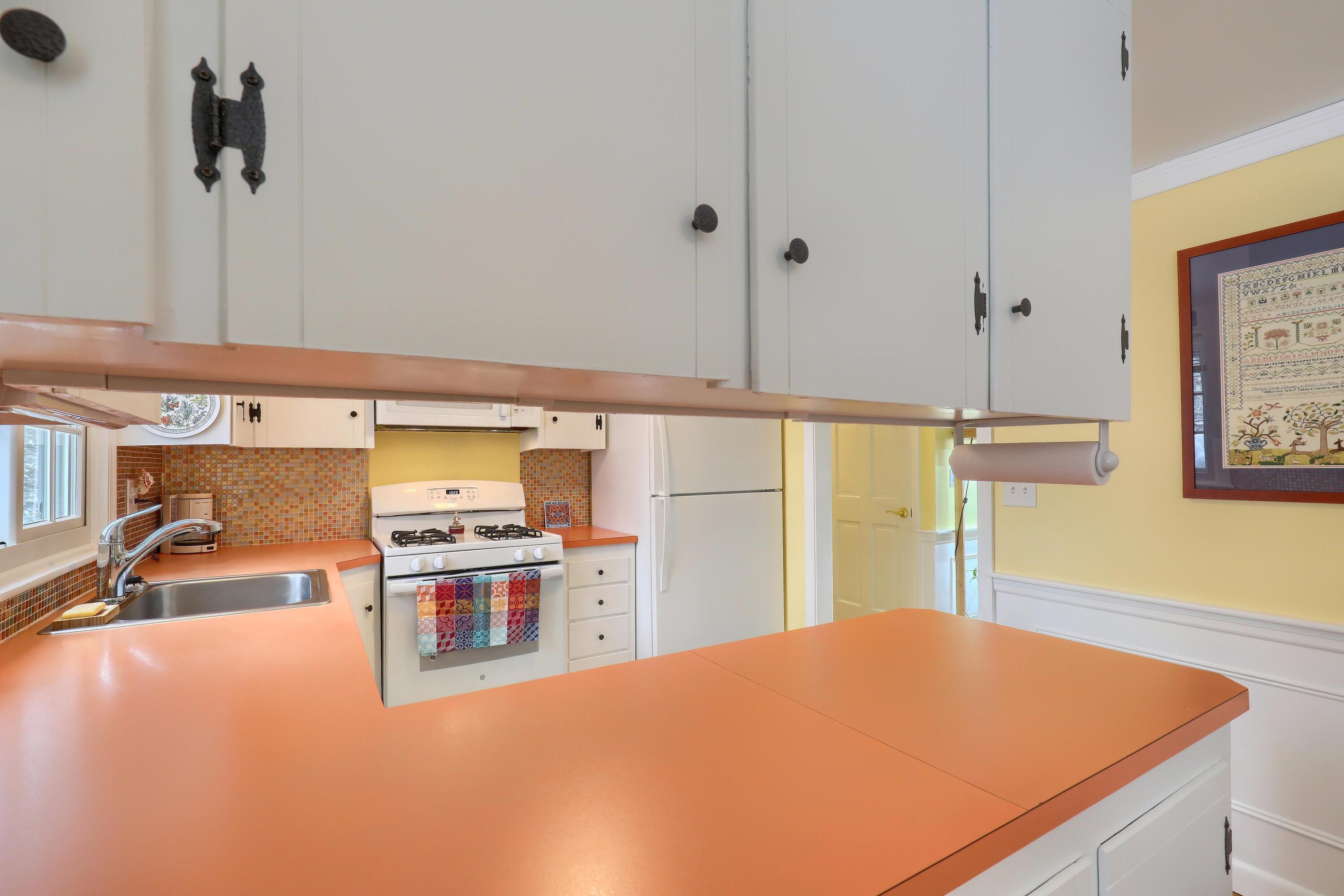 9 Captain Chase Road South Yarmouth, MA 02664 - Photo 12 of 28 a kitchen with stainless steel appliances kitchen island sink stove and cabinets