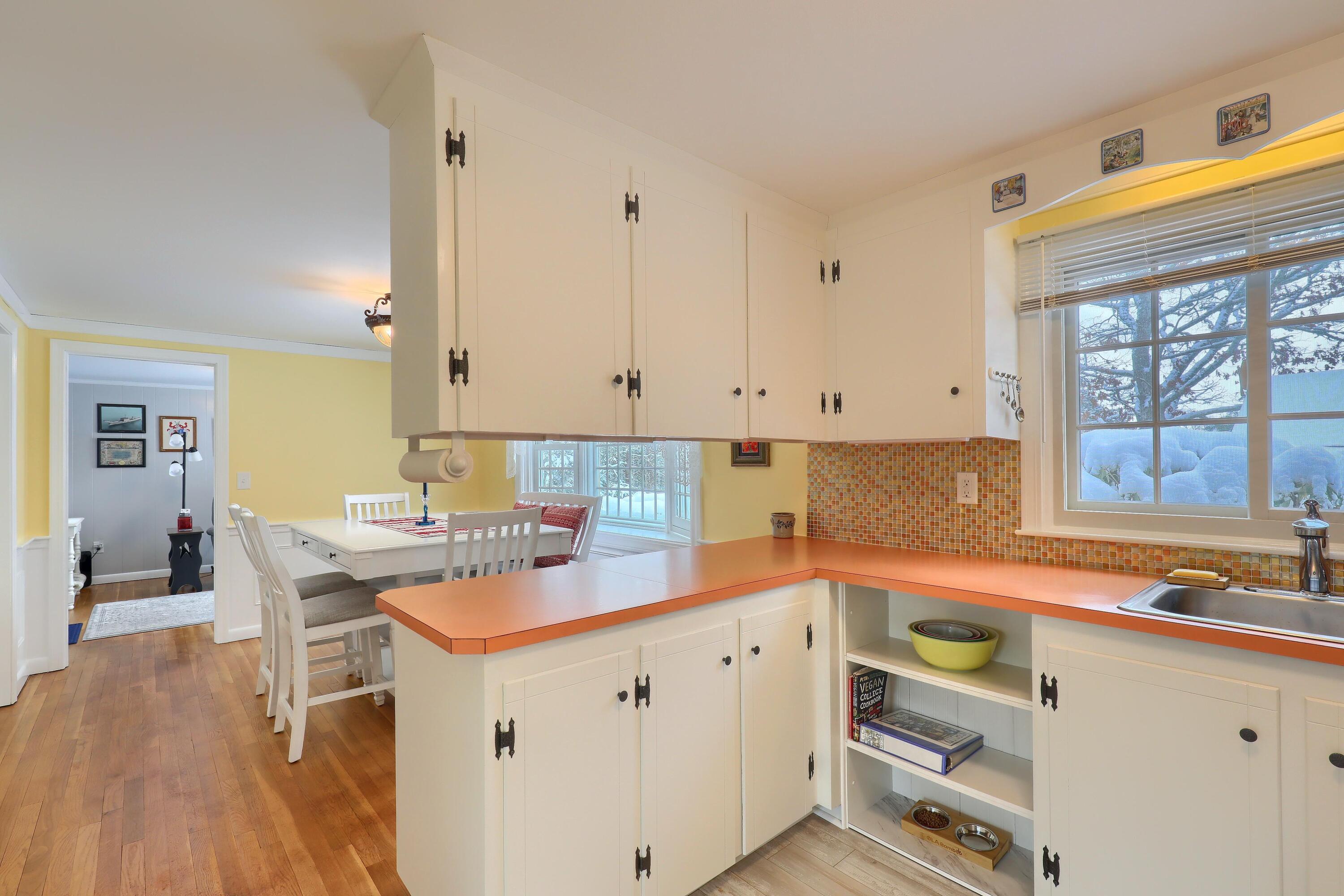 9 Captain Chase Road South Yarmouth, MA 02664 - Photo 13 of 28 a kitchen with a sink and cabinets