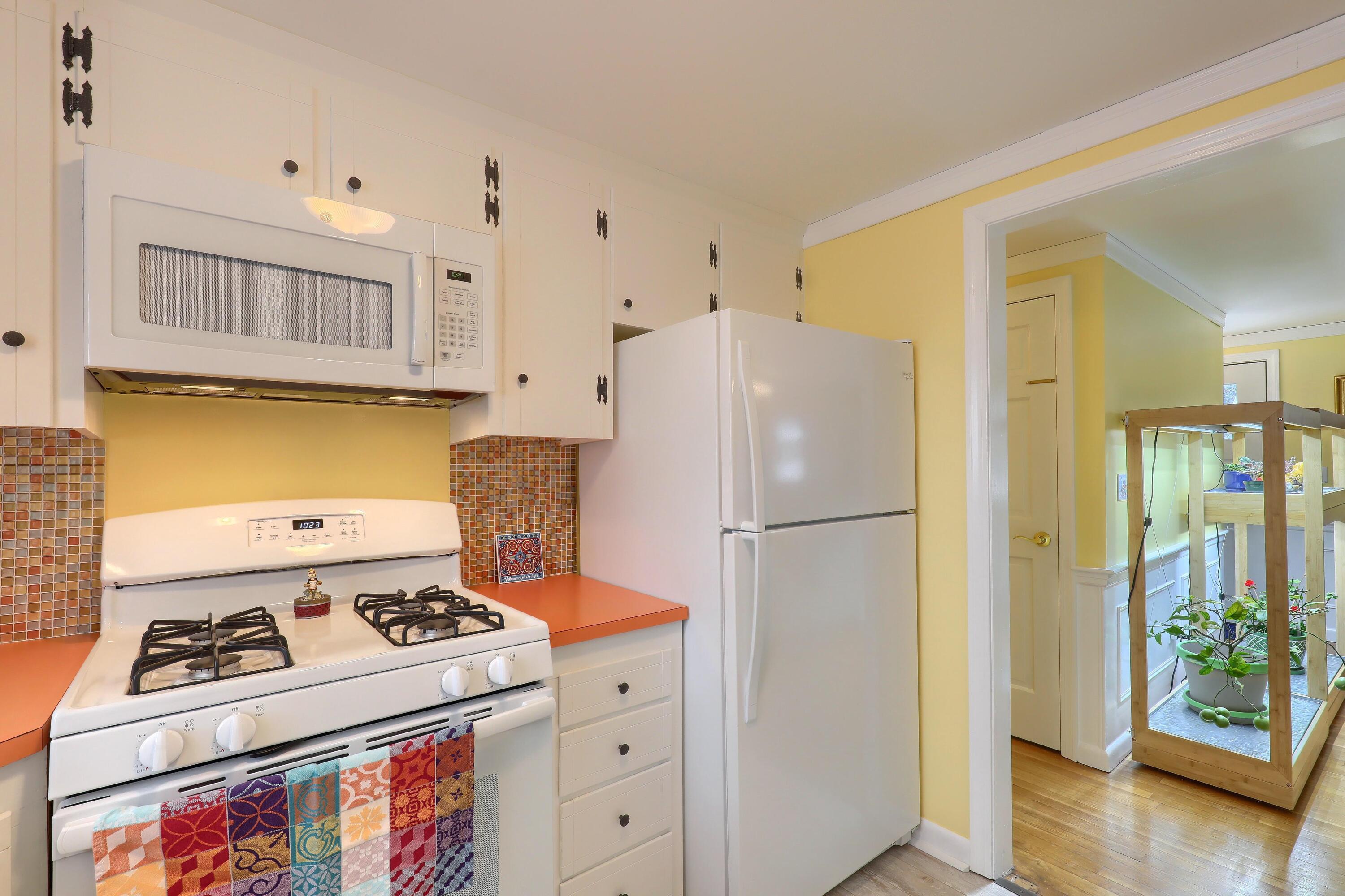 9 Captain Chase Road South Yarmouth, MA 02664 - Photo 14 of 28 a kitchen with a stove and a refrigerator