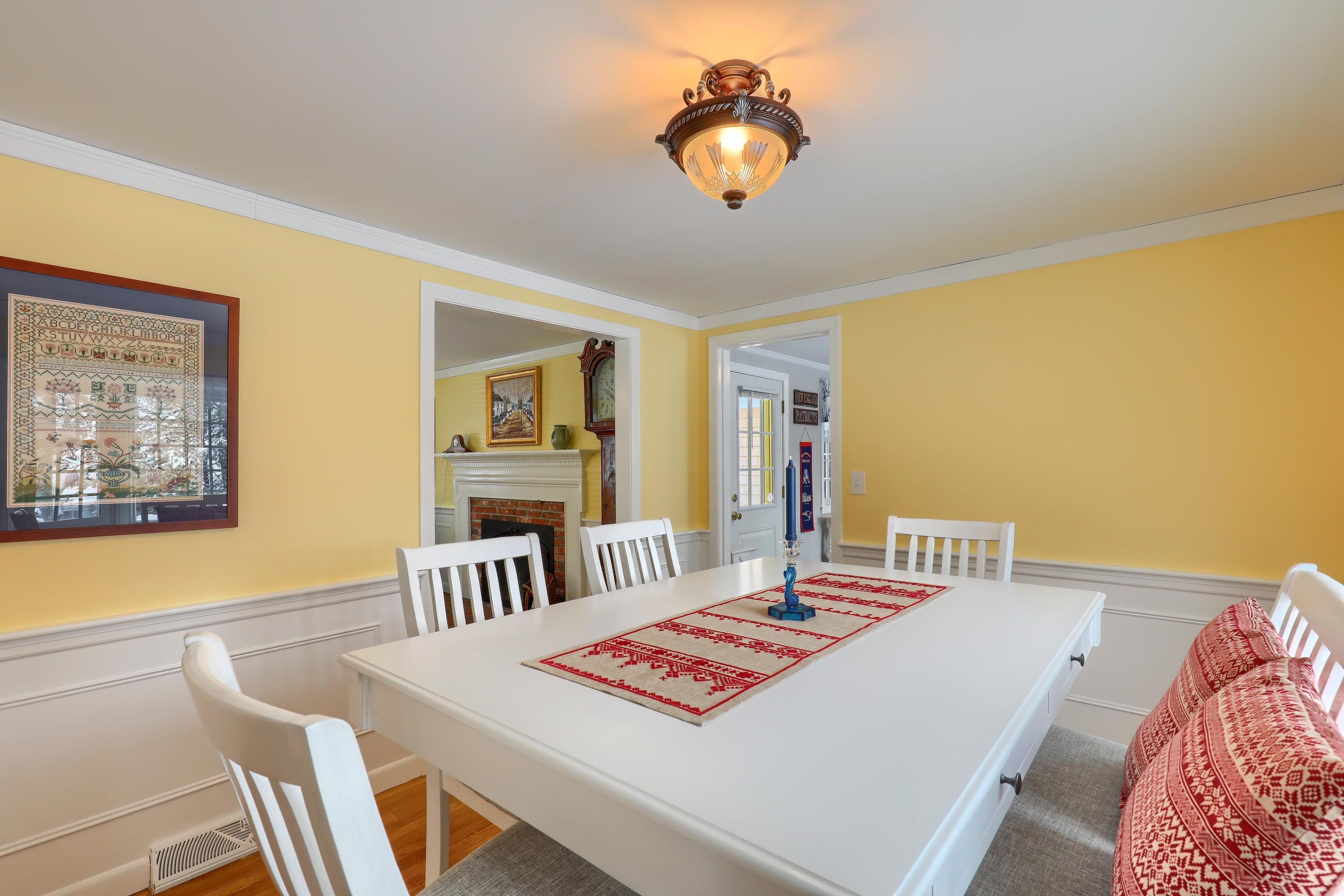 9 Captain Chase Road South Yarmouth, MA 02664 - Photo 16 of 28 a view of a dining room with furniture and a chandelier
