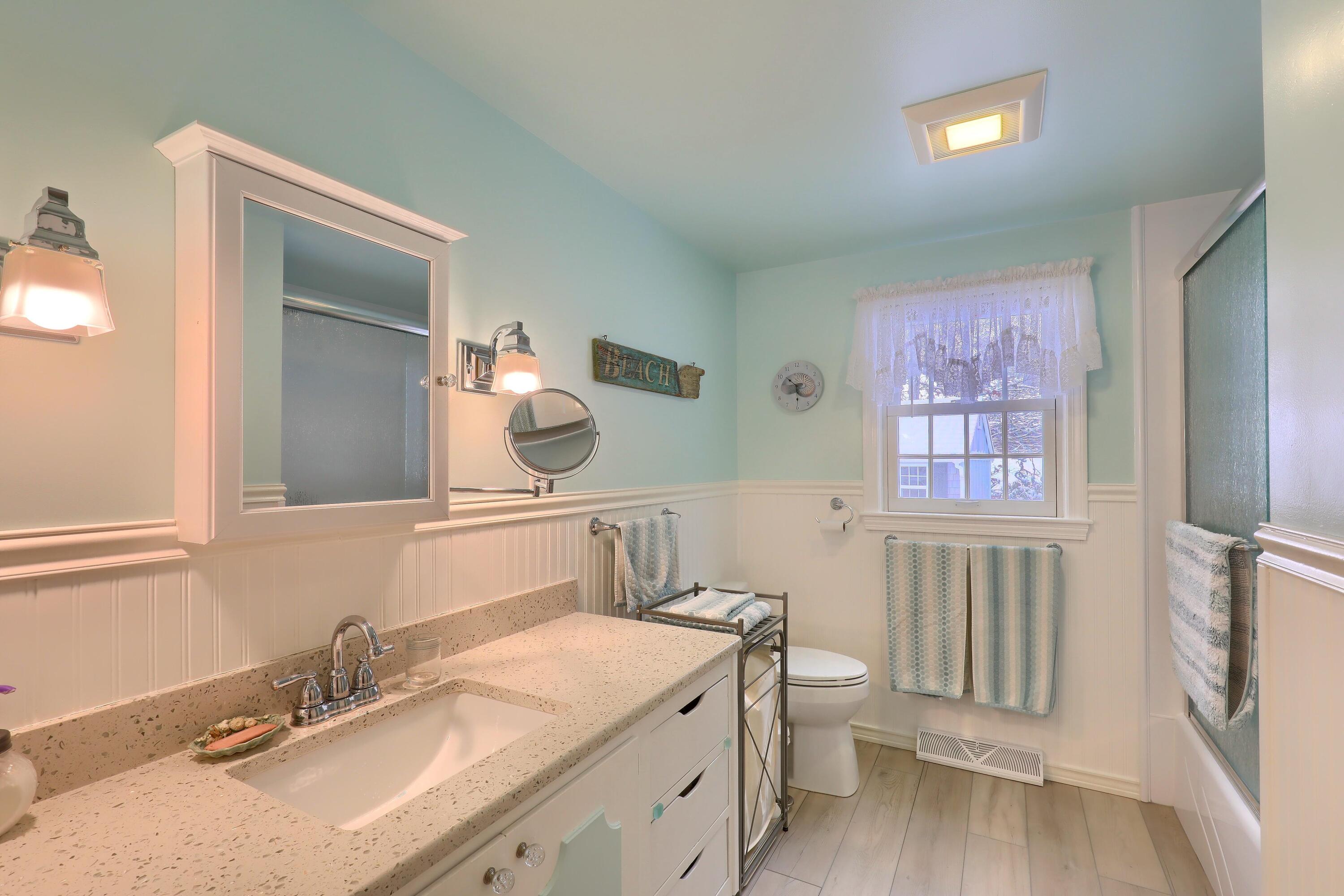 9 Captain Chase Road South Yarmouth, MA 02664 - Photo 20 of 28 a bathroom with a granite countertop double vanity sink a mirror and a toilet