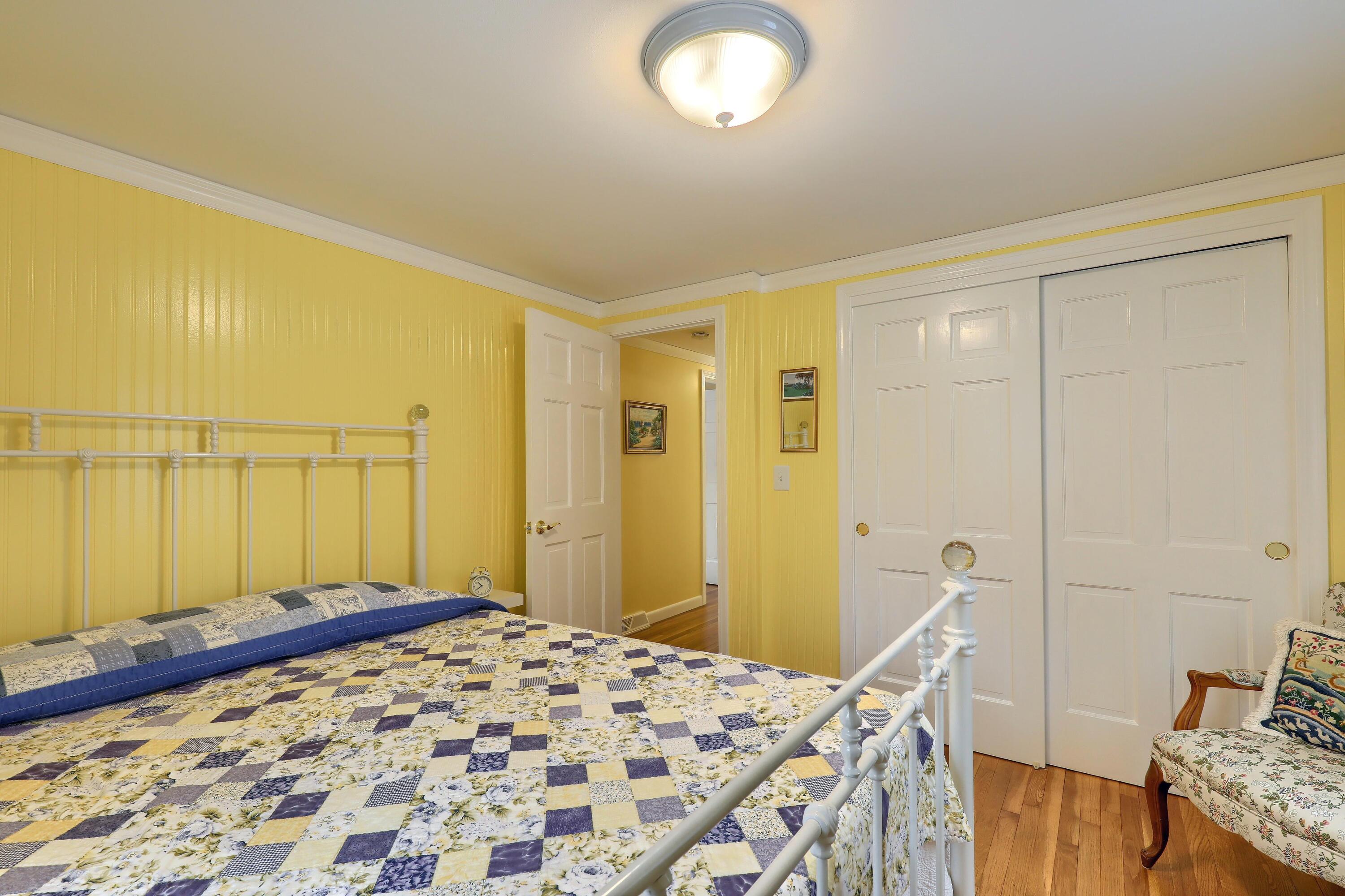 9 Captain Chase Road South Yarmouth, MA 02664 - Photo 22 of 28 a bedroom with a bed and a dresser