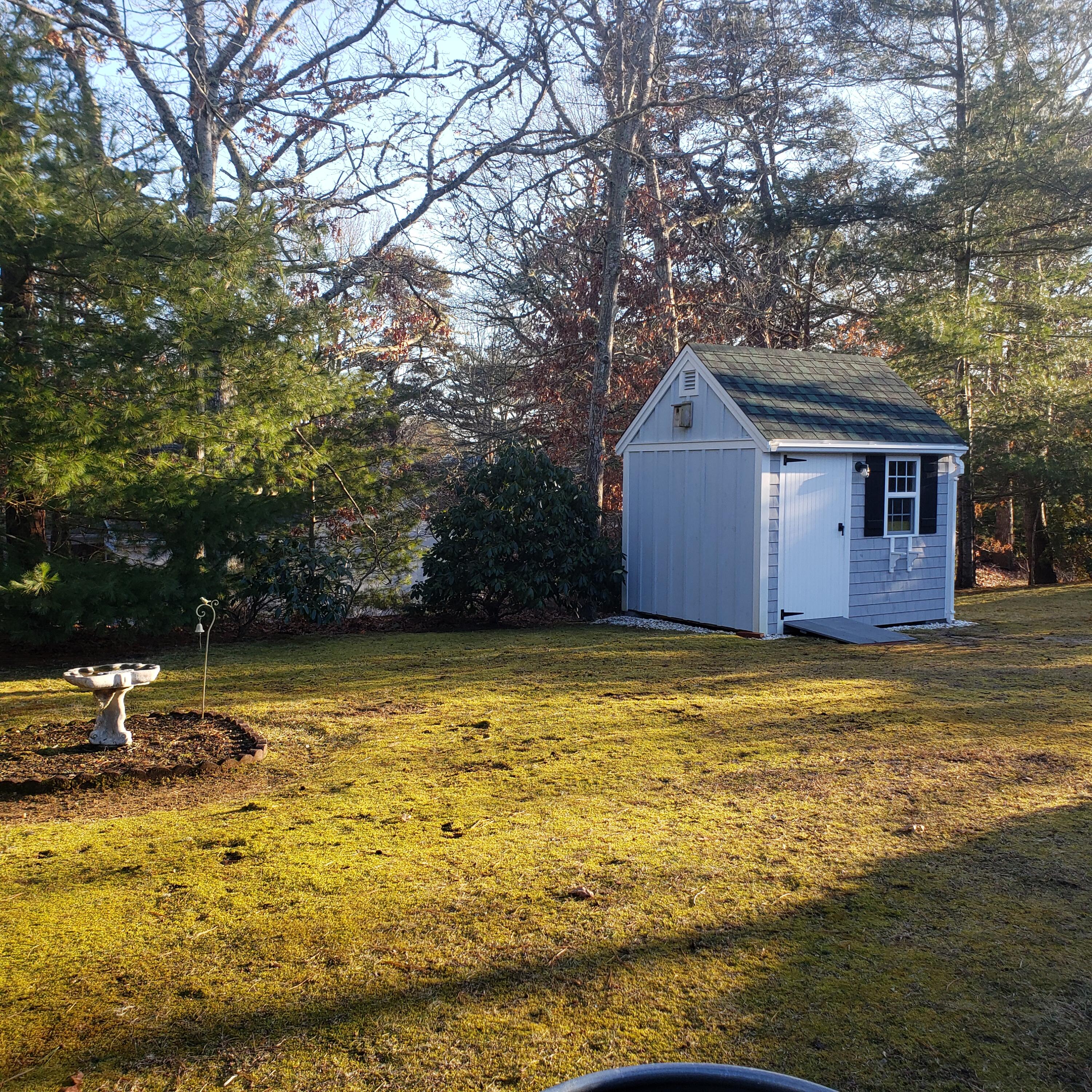 9 Captain Chase Road South Yarmouth, MA 02664 - Photo 26 of 28 a front view of a house with a yard