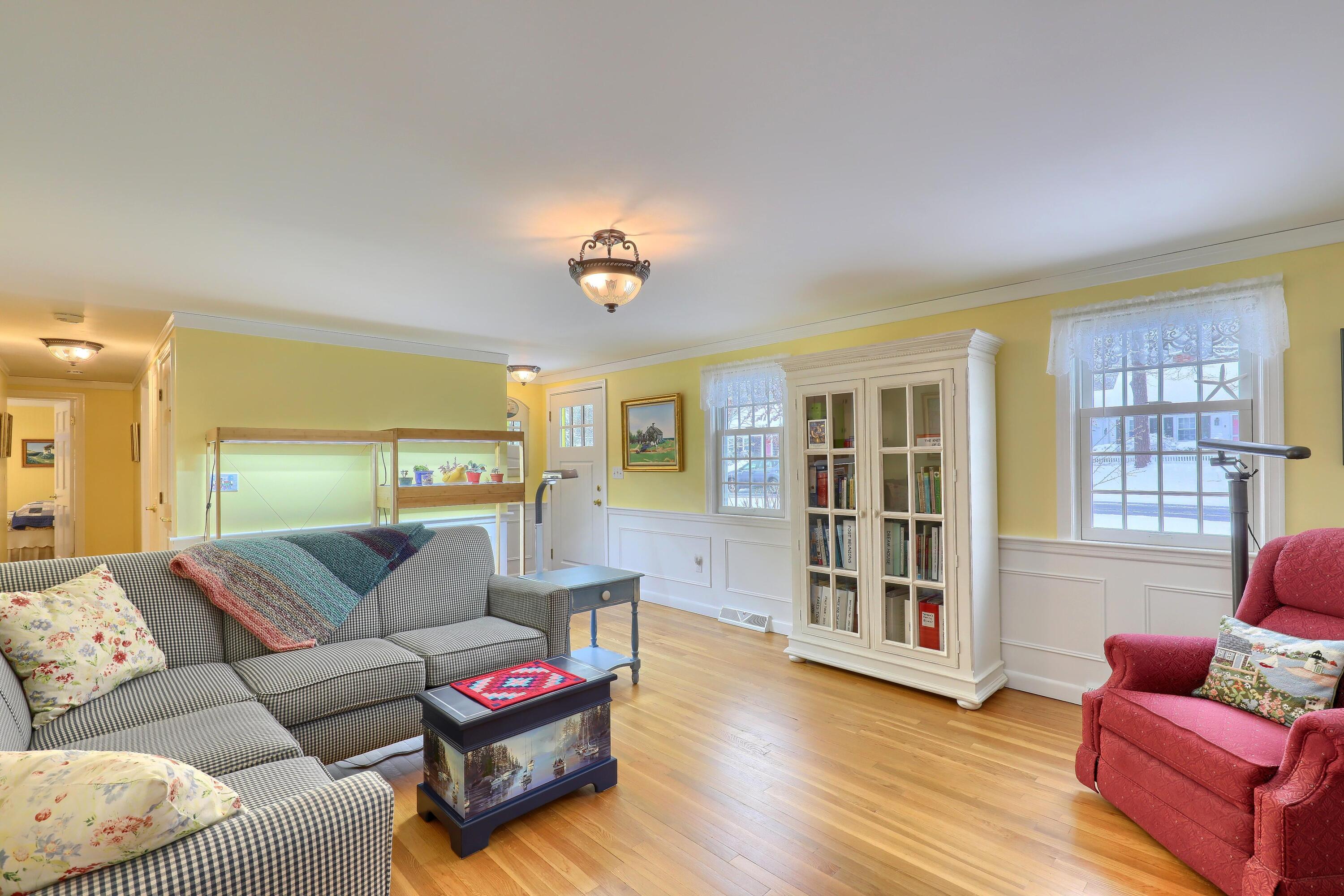 9 Captain Chase Road South Yarmouth, MA 02664 - Photo 4 of 28 a living room with furniture window and wooden floor