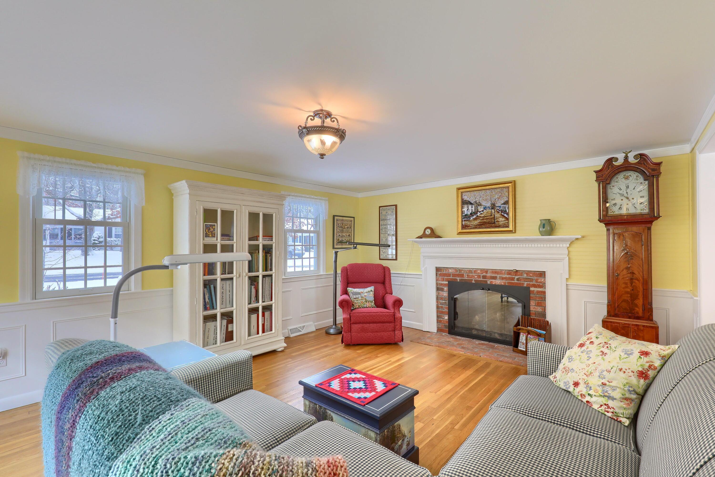 9 Captain Chase Road South Yarmouth, MA 02664 - Photo 5 of 28 a living room with furniture and a fireplace