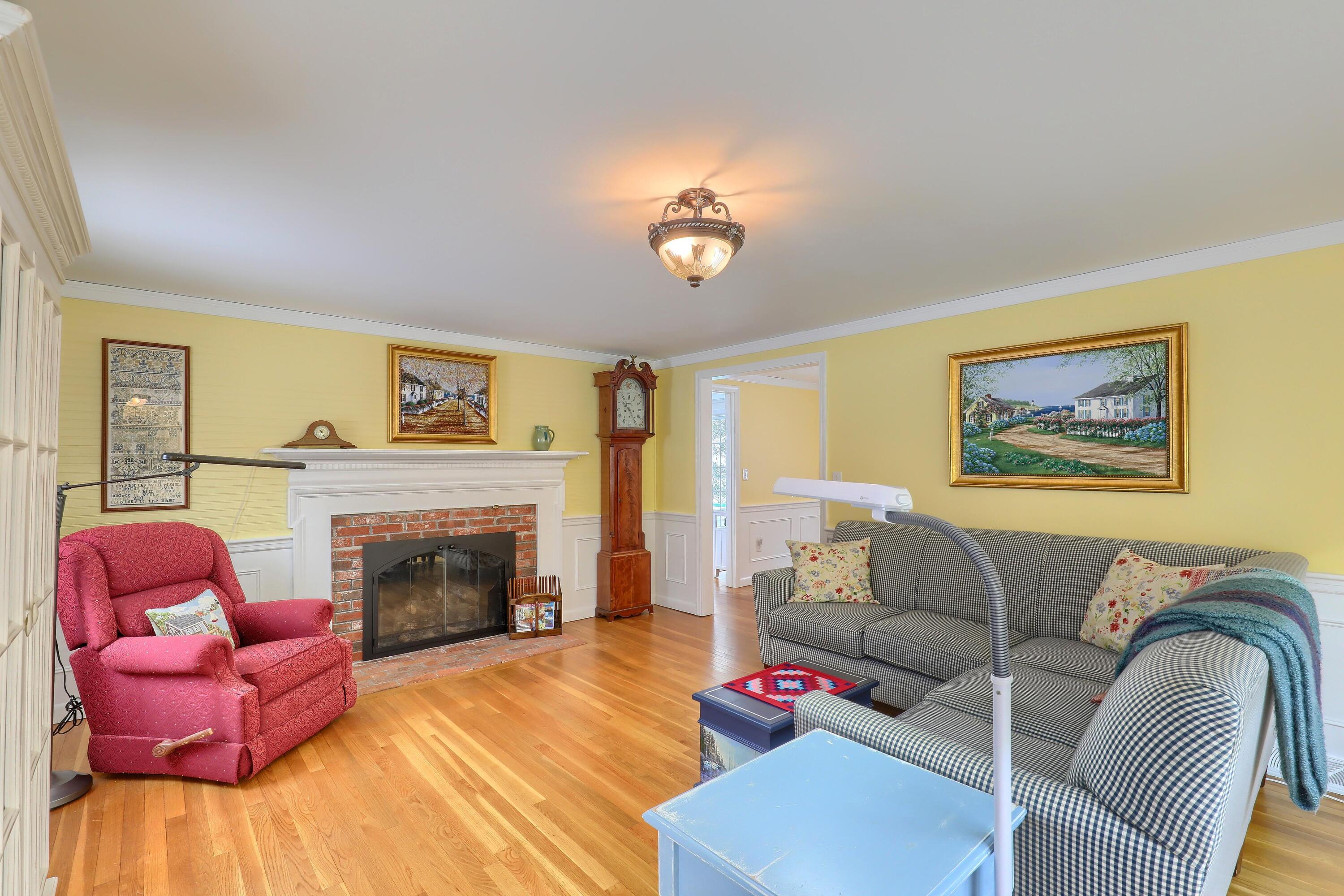 9 Captain Chase Road South Yarmouth, MA 02664 - Photo 6 of 28 a living room with furniture or couch and a fireplace