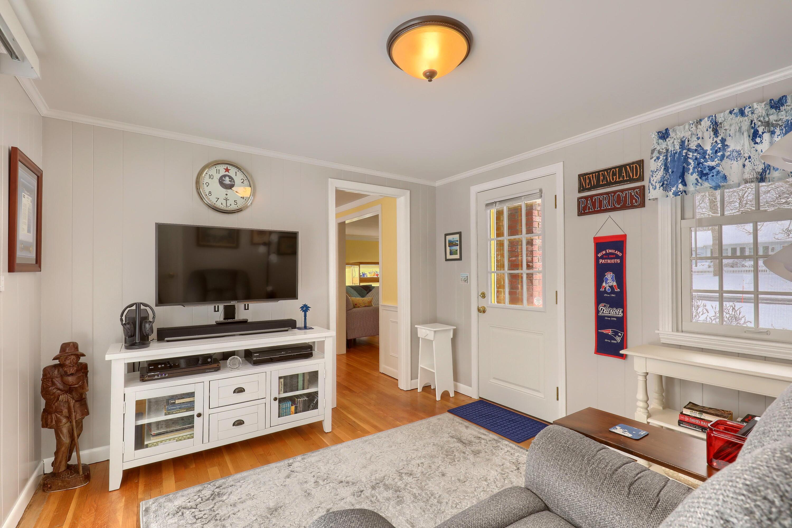 9 Captain Chase Road South Yarmouth, MA 02664 - Photo 9 of 28 a living room with furniture and a flat screen tv